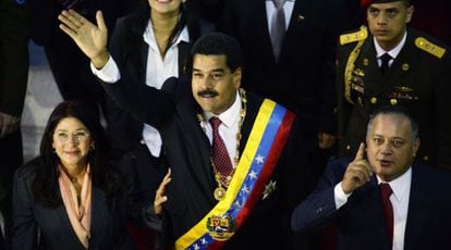 President Nicolás Maduro waves alongside his wife and Speaker Diosdado Cabello on Tuesday night.