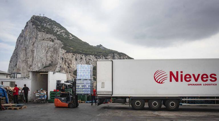 Spanish workers drop off goods near Gibraltar airport.