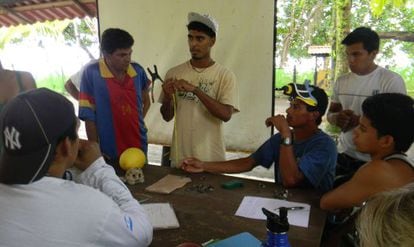 This image released by the Widecast organization shows Jairo Mora (center) instructing a group.