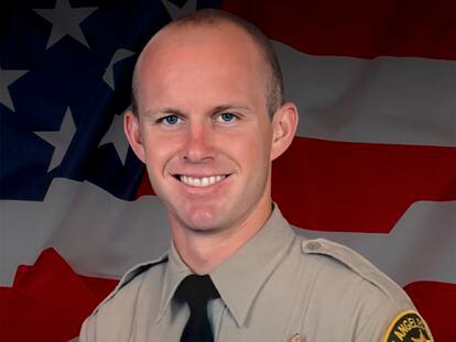 This undated photo provided by Los Angeles County Sheriff’s Department shows its Deputy Ryan Clinkunbroomer.