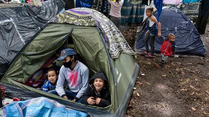 Arelvis Perez, a Venezuelan migrant with her daughters Marly and Ashly at en encampment where jobless and homeless migrants camped during the coronavirus pandemic on June 12, 2020 in Bogota, Colombia.