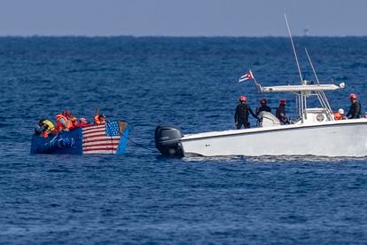 A raft painted with a United States flag is intercepted by the Cuban Coast Guard off the Malecón in Havana.