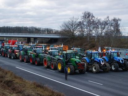 French farmers block a highway with their tractors during a protest in Longvilliers, near Paris, France, January 30, 2024.