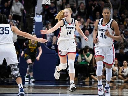 UConn's Dorka Juhasz (14) reaches for teammate Azzi Fudd's hand in the second half of a first-round college basketball game against Baylor in the NCAA Tournament on March 20, 2023.
