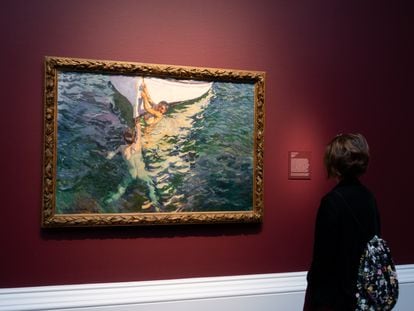 A visitor observes 'The White Boat' (1905), by Joaquín Sorolla, in 'Spanish Light: Sorolla in American Collections', at the Meadows Museum.