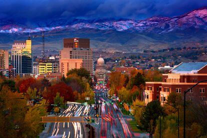 Downtown Boise Idaho at sunset with fresh snow on foothills, viewed from Depot Hill.