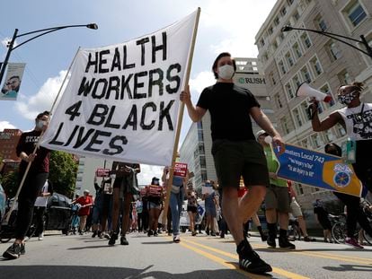 Health care workers at a rally for social justice in health care in June 2020 in Chicago.
