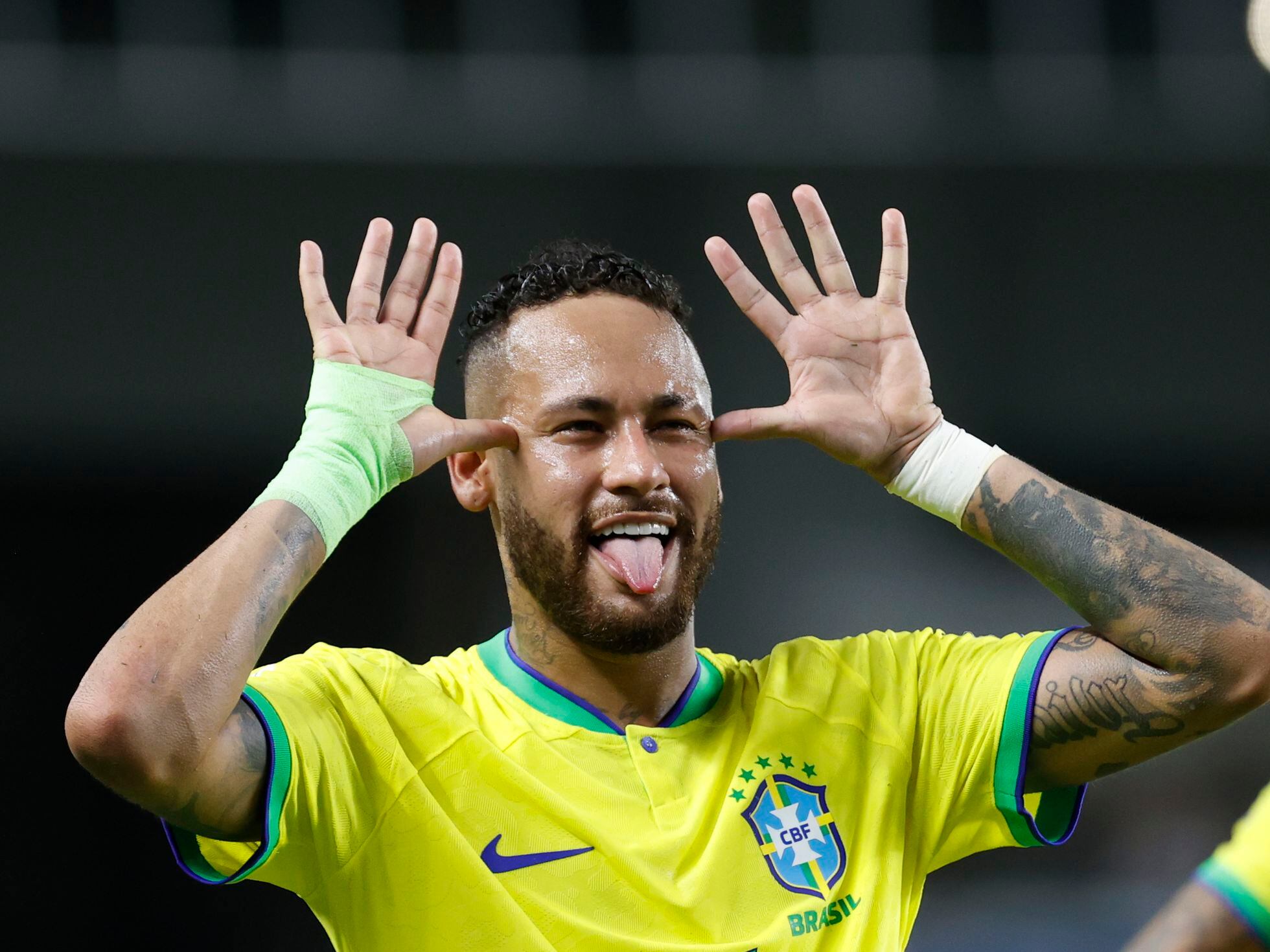 Brazilian football star Neymar, or Neymar Jr., poses as he arrives