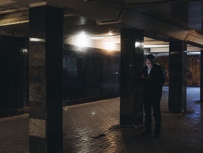 A man looks at his cellphone in an underground passageway on February 25 in Kyiv, Ukraine.
