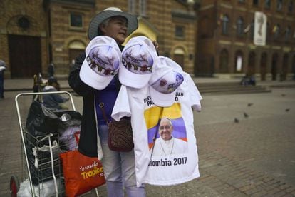 A woman selling pope souvenirs ahead of the visit.
