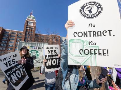 Members of different labor unions join Starbucks unionized employees for a labor protest outside Starbucks Corporate Headquarters, Wednesday, March 22, 2023, in Seattle.
