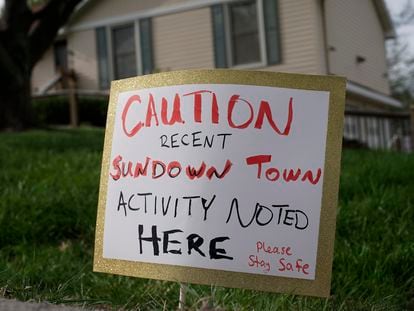 A sign is seen, Wednesday, April 19, 2023, in front of the house where 84-year-old Andrew Lester shot 16-year-old Ralph Yarl a week earlier in Kansas City