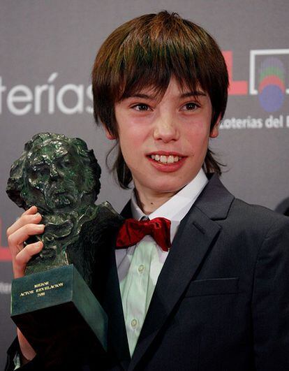 Francesc Colomer poses after receiving the Goya Award for Best Actor for his work in <i> Pa negre .</i>