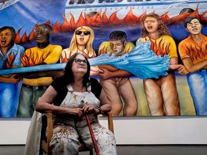 Artist Judy Baca sits in front of a section of the mural ‘Generation On Fire’ on October 26 at LACMA.