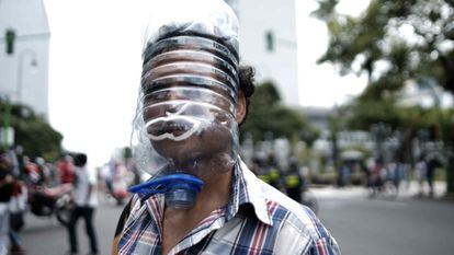 A protester wearing a home-made face shield at a July march against the government's coronavirus measures in San José, Costa Rica.