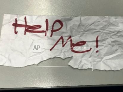 In this undated photo released by the U.S Department of Justice is a "Help Me!" sign used by a 13-year-old girl kidnapped in Texas.