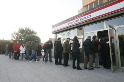 People wait in line at a labor center in the Madrid neighborhood of Moratalaz.