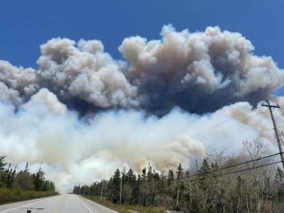 In this May 28, 2023, image courtesy of the Nova Scotia Government in Canada, smoke rises from a wildfire near Barrington Lake in Nova Scotia's Shelburne County.