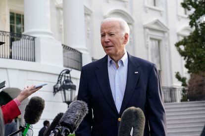 President Joe Biden talks with reporters on the South Lawn of the White House in Washington, Friday, March 31, 2023
