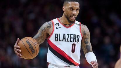 Portland Trail Blazers guard Damian Lillard brings the ball up against the New York Knicks during the second half of an NBA basketball game in Portland, Ore., Tuesday, March 14, 2023.