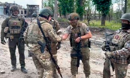 In this grab taken from video released by Prigozhin Press Service on Saturday, May 20, 2023, Yevgeny Prigozhin, the owner of the Wagner Group military company shakes hands with his soldiers, in Bakhmut, Ukraine.