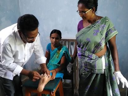 A doctor treats a leprosy patient at the Chilakalapalli hospital in Vizianagaram district, Andhra Pradesh, India in 2022.