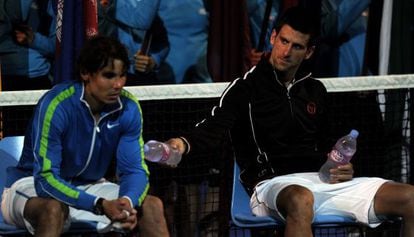 Nadal and Djokovic await the trophy ceremony after the Australian Open final in January.