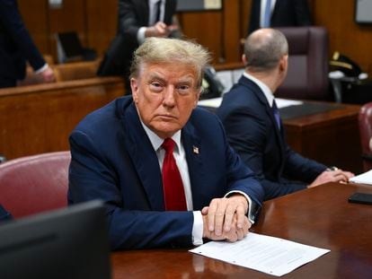 Former U.S. President Donald Trump attends the first day of his trial in Manhattan Criminal Court in New York on Monday.