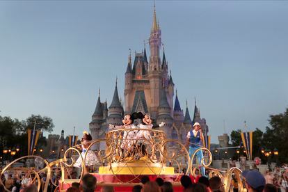 Mickey and Minnie Mouse perform during a parade at the Magic Kingdom theme park at Walt Disney World in Lake Buena Vista, Florida, in 2020.