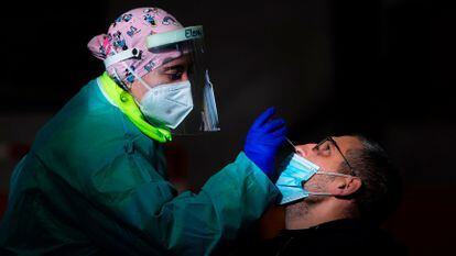 A health worker conducts an antigen test in Tui, in northwestern Spain.