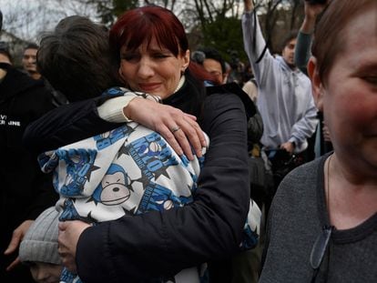 Inessa hugs her son Vitali after he arrives in Kyiv from Russian-controlled Ukrainian territory on March 22, 2023.