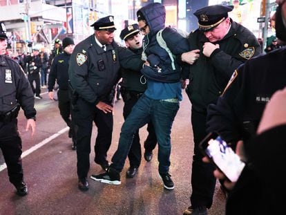 A demonstrator is detained by police during an arrest in New York City, on Friday, January 27, 2023.
