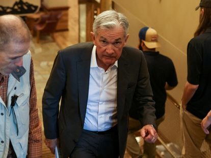 Federal Reserve Chair Jerome Powell walks in Teton National Park where financial leaders gathered for the Jackson Hole economic symposium outside Jackson, Wyoming, on Aug. 26, 2022.