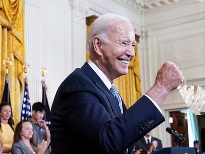 U.S. President Joe Biden gives a fist bump salute to the audience during an event to celebrate the anniversary of his signing of the 2022 Inflation Reduction Act legislation, in the East Room of the White House in Washington, U.S., August 16, 2023.