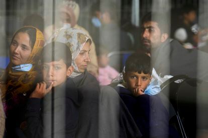 Evacuees from Afghanistan wait with other evacuees to fly to the United States or another safe location in a makeshift departure gate inside a hanger at the United States Air Base in Ramstein, Germany, Sept. 1, 2021.