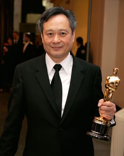 Ang Lee shows off his Oscar for Best Director for the 2006 film ‘Brokeback Mountain,’ during one of the gala’s after-parties.