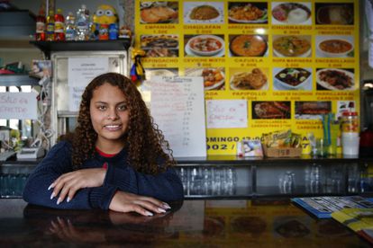 Angie López, 19, from Ecuador, runs the family store La Sazón Guayaca, which is one of the newer stores opened by immigrants in Entrevías. Immigrants make up 20% of the neighborhood.