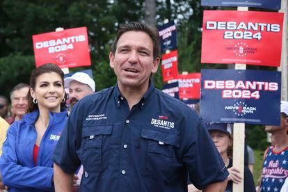 Republican presidential candidate and Florida Gov. Ron DeSantis and his wife Casey, walk in the July 4th parade, July 4, 2023, in Merrimack, N.H.