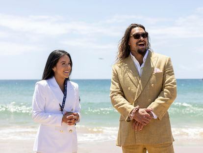 Daniela Fernandez, left, founder and CEO of Sustainable Ocean Alliance, and actor and ocean activist Jason Momoa smile during a ceremony at the UN Ocean Conference where Momoa was made a United Nations advocate for Life Below Water in June, 2022