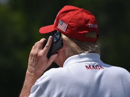 Former President Donald Trump speaks on the phone during a visit to a Washington golf course on May 27.