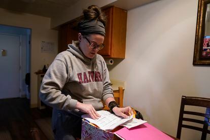 Samantha Richards looks over her Medicaid papers
