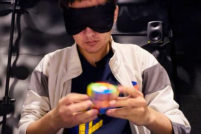 University of Michigan student Stanley Chapel solves a Rubik's Cube while blindfolded, Wednesday, Nov. 23, 2022, in Ann Arbor, Mich.