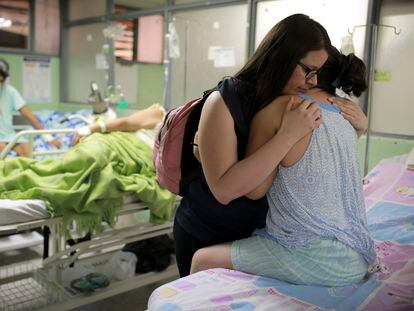 A woman recovering from Guillain-Barré Syndrome hugs her niece.