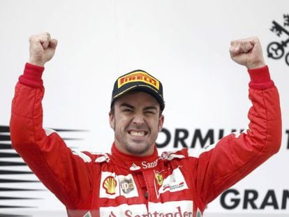 Ferrari Formula One driver Fernando Alonso of Spain celebrates his win during the victory ceremony after the Chinese F1 Grand Prix.