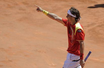 Spain&#039;s David Ferrer celebrates after winning the fourth Davis Cup quarterfinal match against Austrian Jurgen Melzer. 