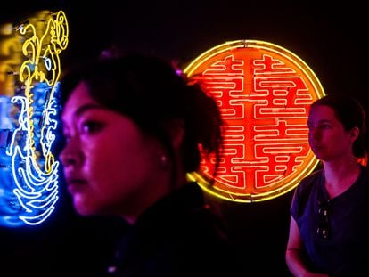 Visitors at the neon exhibition at the Tai Kwun complex in Hong Kong, on July 5, 2023.