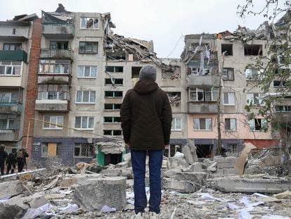 A local resident looks at his home, damaged by a Russian rocket attack in Sloviansk, Ukraine, on April 14.