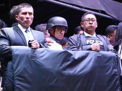 Police guard presidential candidate Christian Zurita during his closing campaign rally in Quito, Ecuador, on August 17, 2023.