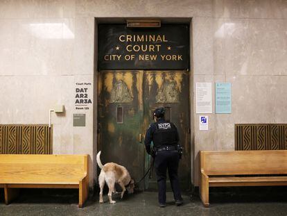An officer from the New York City Police Department Canine Unit checks outside the Manhattan Criminal Court in New York City, on March 27, 2023.