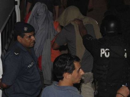 Police arrest two male nurses in Montevideo on Sunday.